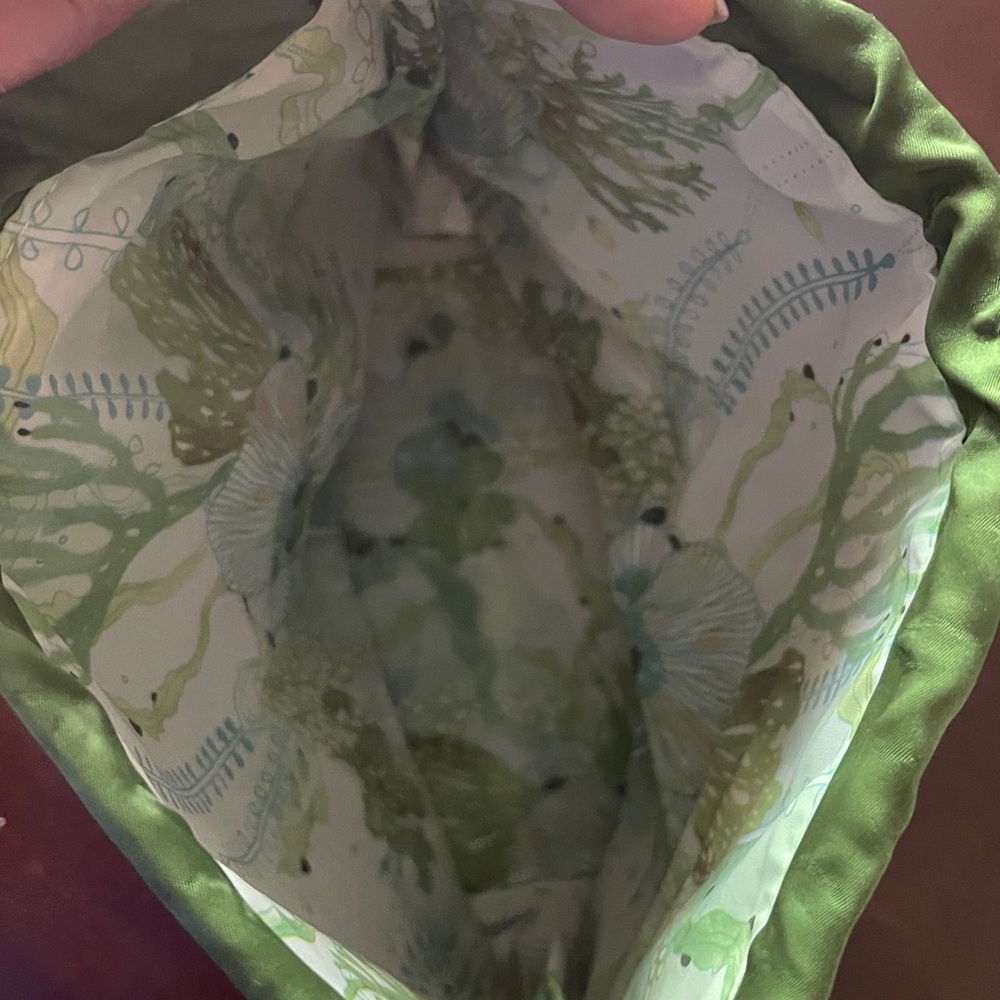 Vibrant Green Glossy Cosmetic bag from LAMER with Unstructured Design